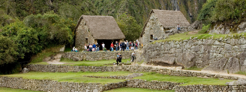 Traveler taking photo at the Guardian House viewpoint in Machu Picchu
